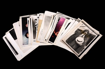 Lot 1350 - Record label promotional black and white photographs of bands and musicians