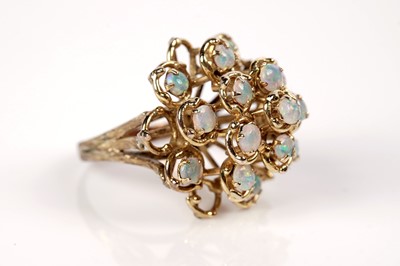 Lot 1097 - An opal cluster ring