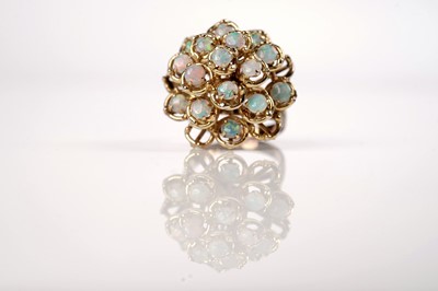 Lot 1097 - An opal cluster ring