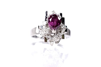 Lot 39 - A ruby and diamond cluster ring