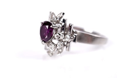 Lot 39 - A ruby and diamond cluster ring