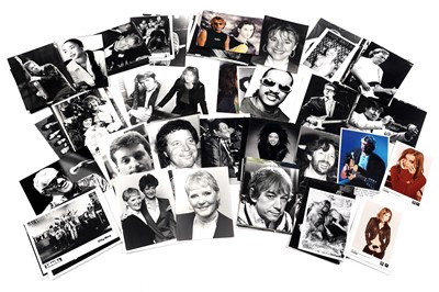 Lot 1407 - Record label promotional black and white and colour photographs of bands and musicians