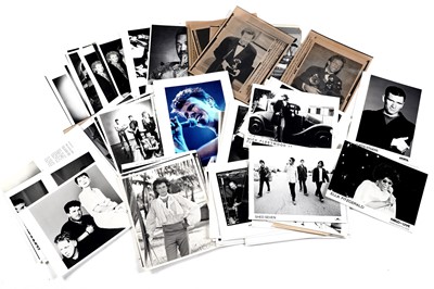 Lot 1408 - Record label promotional photographs and wire images of bands and musicians
