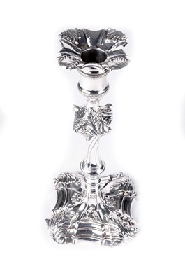 Lot 1531 - A pair of early George III cast silver candlesticks