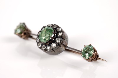 Lot 1117 - A Victorian peridot and diamond cluster bar brooch
