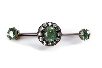 Lot 1117 - A Victorian peridot and diamond cluster bar brooch