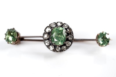 Lot 1117 - A Victorian peridot and diamond cluster bar brooch