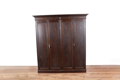 Lot 102 - A large early 20th Century stained oak wardrobe