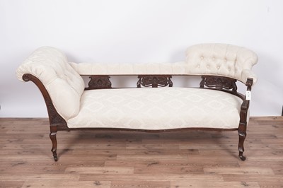 Lot 80 - A late Victorian carved mahogany button back chaise longue/sofa