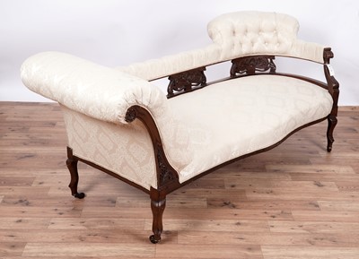 Lot 80 - A late Victorian carved mahogany button back chaise longue/sofa