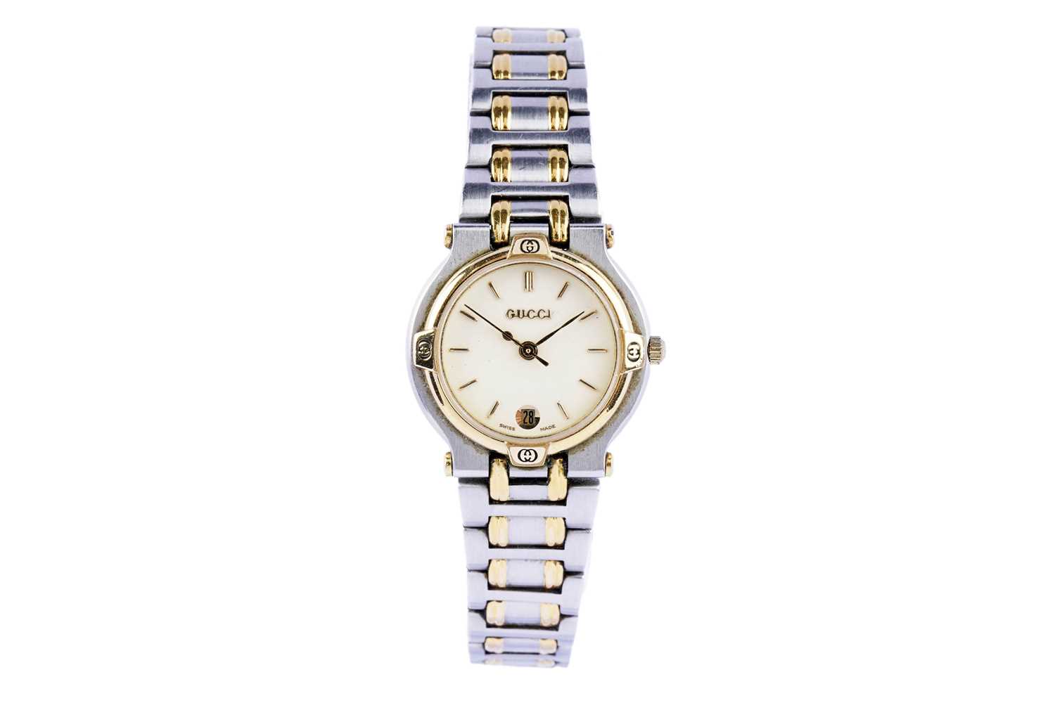 Lot 574 - Gucci: a lady's steel and gilt metal cased wristwatch