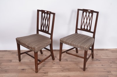 Lot 60 - A set of eight Regency mahogany and satinwood banded dining chairs