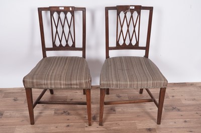 Lot 60 - A set of eight Regency mahogany and satinwood banded dining chairs
