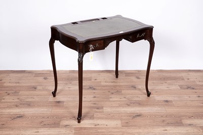 Lot 7 - An Edwardian style serpentine fronted writing desk