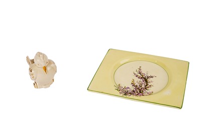 Lot 392 - A Clarice Cliff plate; and a pipe holder