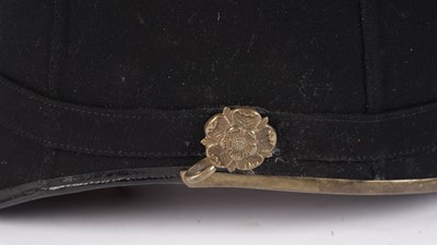 Lot 94 - British Military Home Pattern blue cloth helmet; and four caps