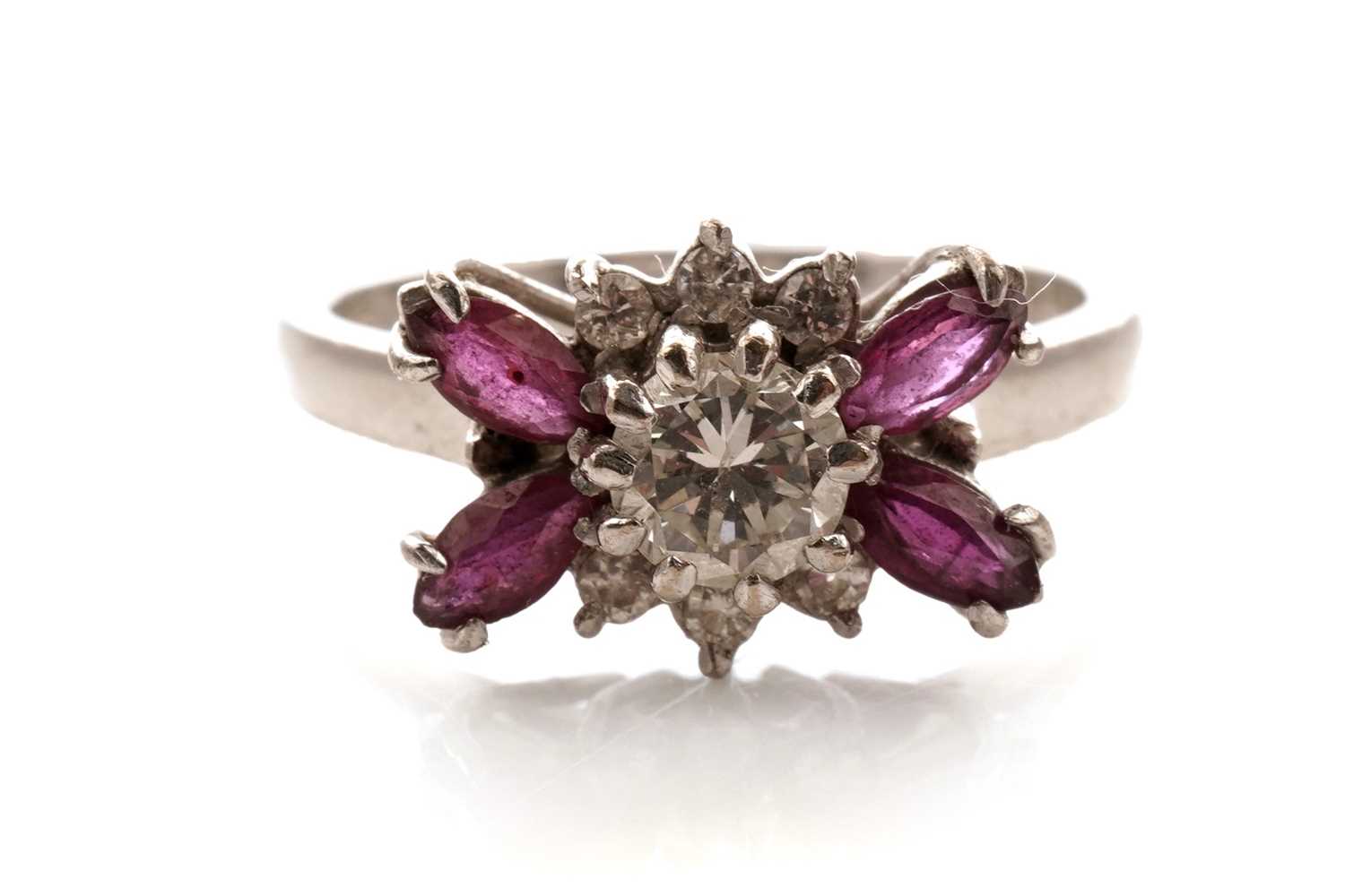 Lot 34 - An Art Deco style diamond and ruby dress ring