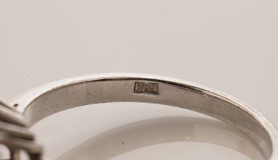 Lot 34 - An Art Deco style diamond and ruby dress ring