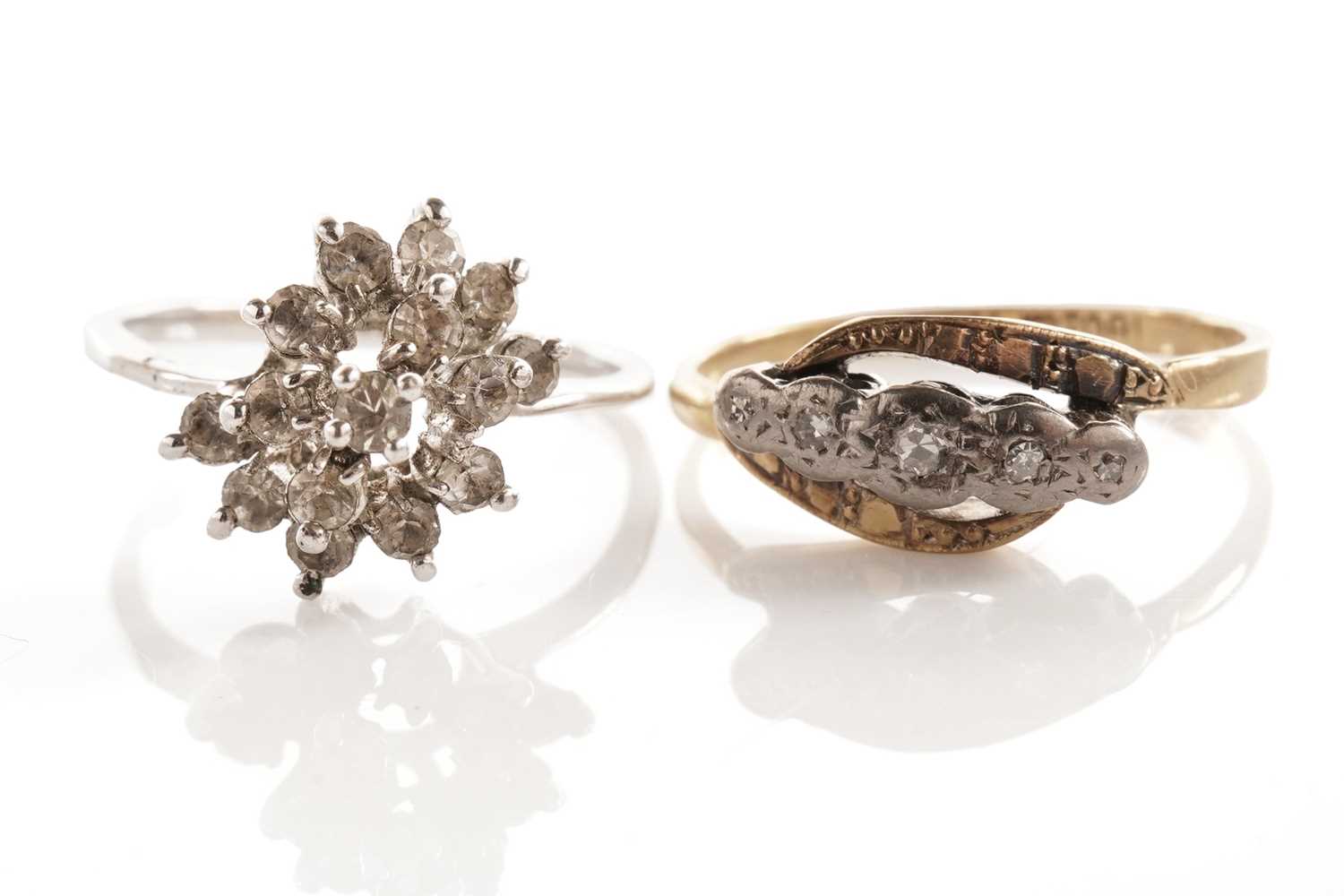 Lot 42 - A diamond five-stone ring; and a cluster dress ring