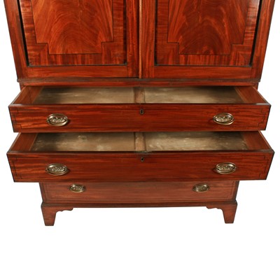 Lot 77 - A late George III mahogany tray wardrobe or press