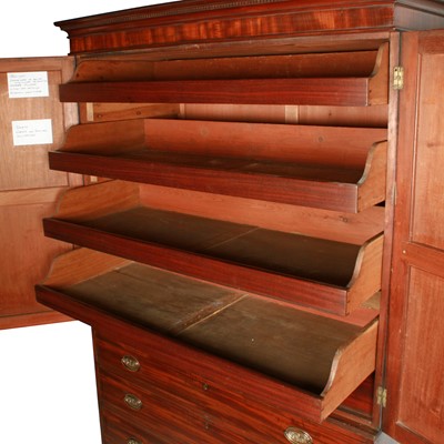 Lot 77 - A late George III mahogany tray wardrobe or press