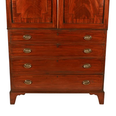 Lot 77 - A late George III mahogany tray wardrobe or press