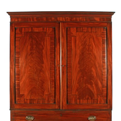 Lot 77 - A late George III mahogany tray wardrobe or press