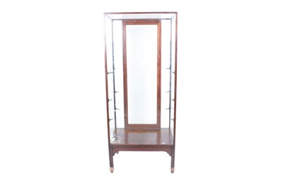 Lot 632 - A mid-20th Century walnut shop display cabinet