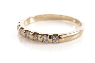 Lot 52 - A diamond half hoop eternity ring