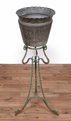 Lot 11 - A vintage metal jardiniere on stand; and two items of brass ware