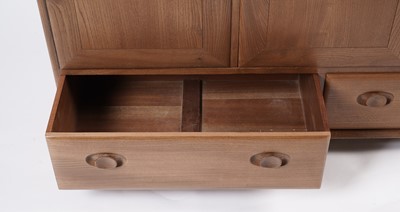 Lot 818 - An Ercol elm and beech dining room suite