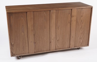 Lot 818 - An Ercol elm and beech dining room suite