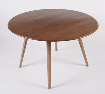 Lot 818 - An Ercol elm and beech dining room suite