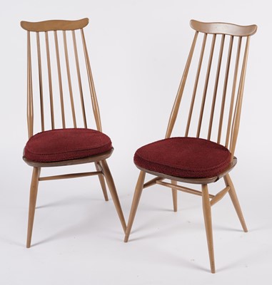 Lot 818 - An Ercol elm and beech dining room suite