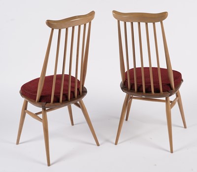 Lot 818 - An Ercol elm and beech dining room suite