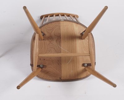 Lot 818 - An Ercol elm and beech dining room suite
