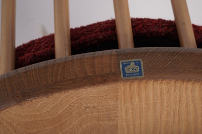 Lot 818 - An Ercol elm and beech dining room suite