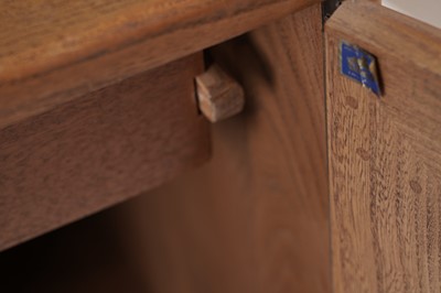 Lot 818 - An Ercol elm and beech dining room suite