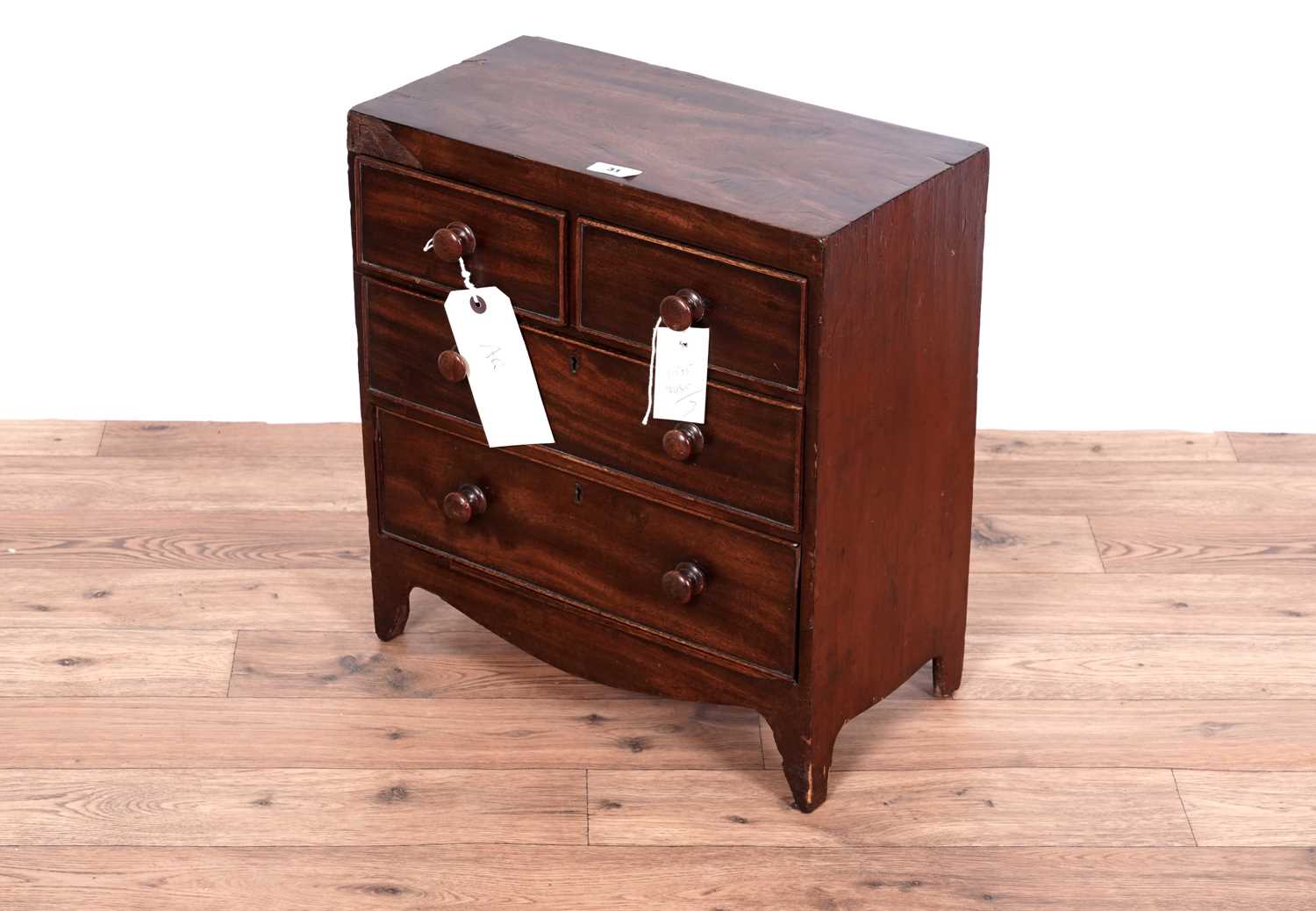 Lot 31 - A George III miniature mahogany chest of drawers