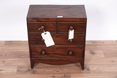 Lot 31 - A George III miniature mahogany chest of drawers