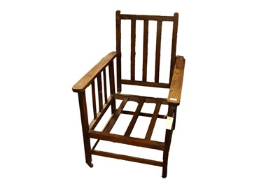 Lot 64 - An early 20th Century oak Arts and Crafts Campaign armchair