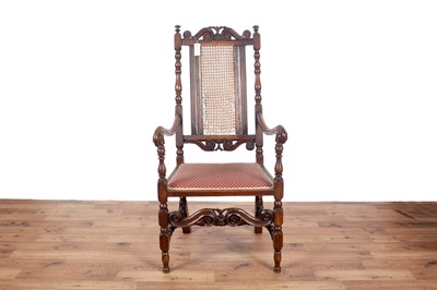 Lot 67 - Two late 19th/early 20th Century Jacobean style carved oak armchairs