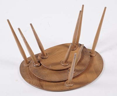 Lot 779 - An Ercol model 354 ‘Pebble’ nest of three elm-topped tables