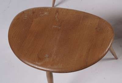 Lot 779 - An Ercol model 354 ‘Pebble’ nest of three elm-topped tables