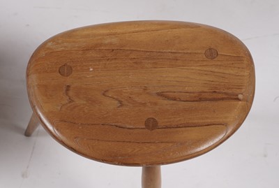 Lot 779 - An Ercol model 354 ‘Pebble’ nest of three elm-topped tables