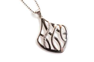 Lot 41 - An openwork cubic zirconia set silver pendant on chain