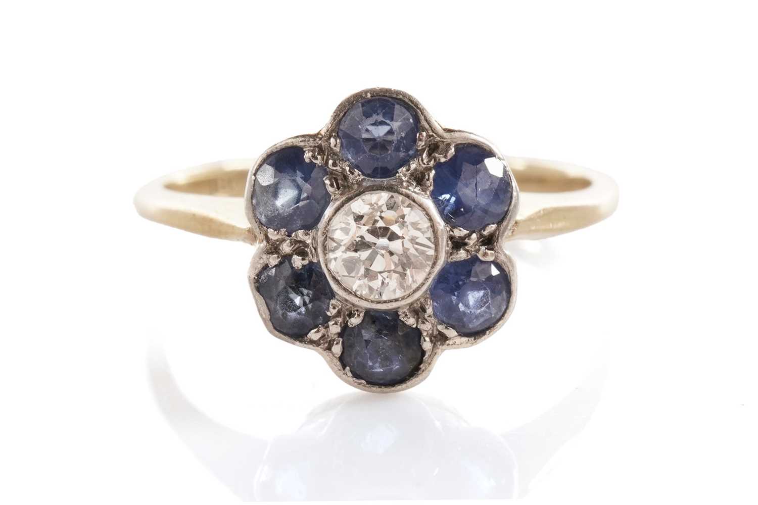 Lot 46 - A sapphire and diamond flower cluster ring