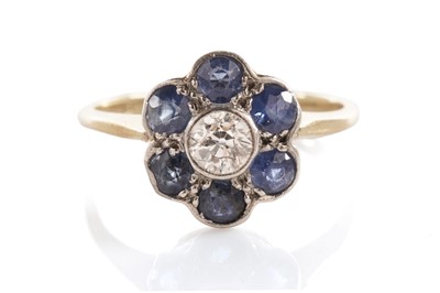 Lot 46 - A sapphire and diamond flower cluster ring