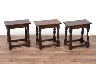 Lot 41 - A set of three Jacobean style set of three oak stools