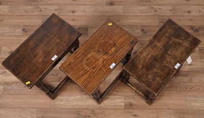 Lot 41 - A set of three Jacobean style set of three oak stools